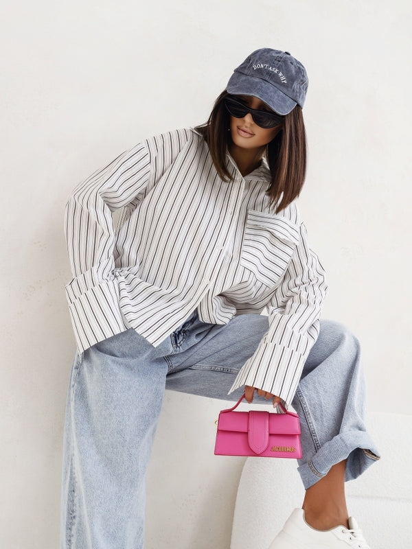 Striped long-sleeve button-down shacket with point collar, vertical black-and-white stripes