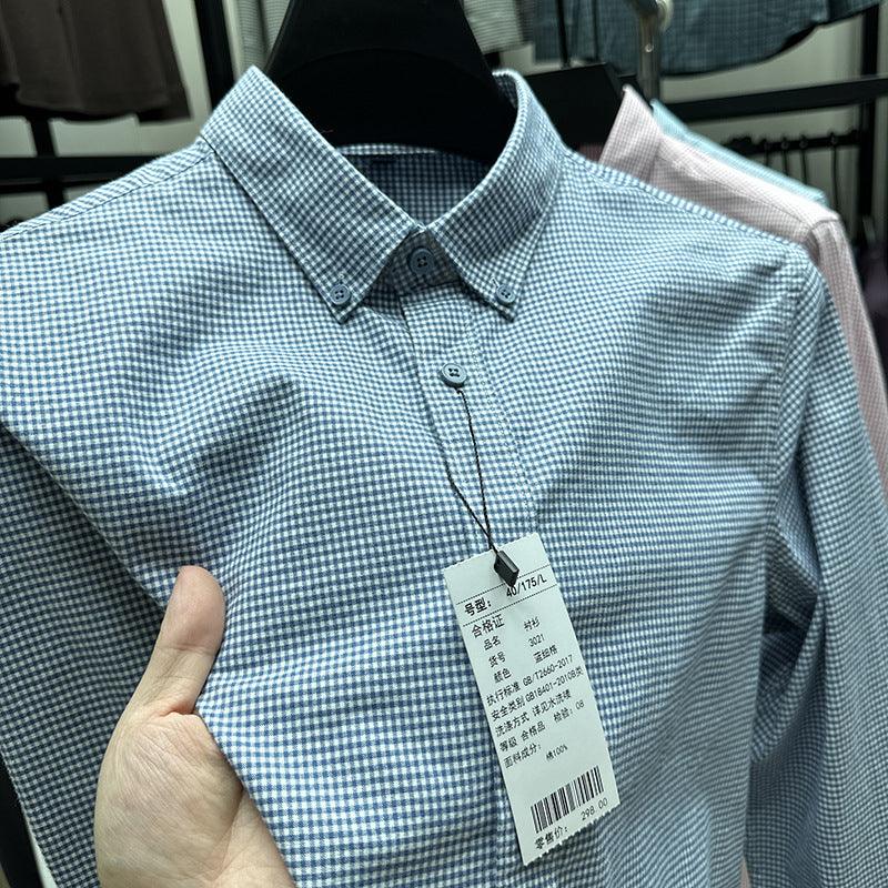 Men's long-sleeve button-up shirt in light blue fine grid, point collar, front view