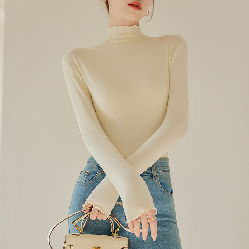 Beige long-sleeve base shirt with ruffled hem and mock turtleneck