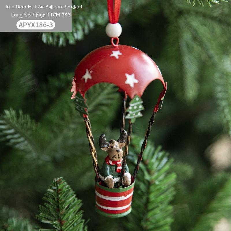 Reindeer hot air balloon pendant with reindeer and green tree pattern on metal basket