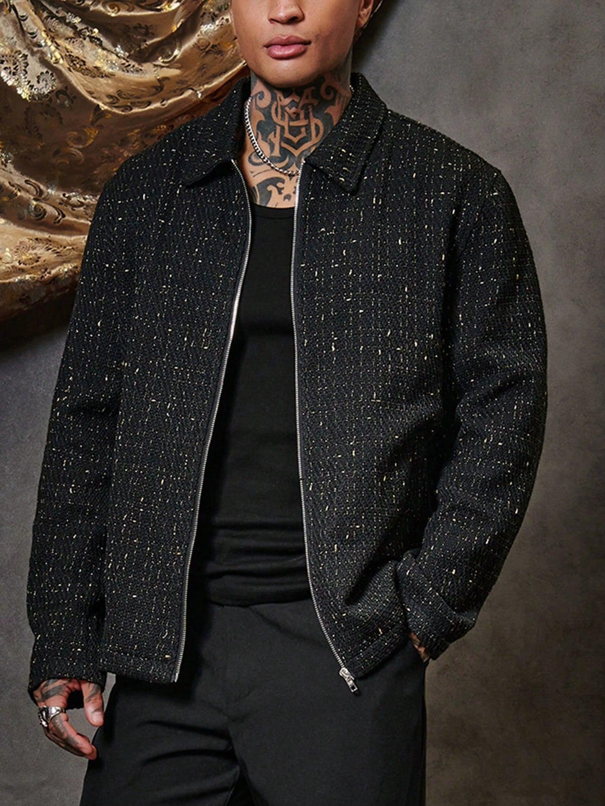 Black textured lapel-zip jacket with front zipper, lapels, and side pockets