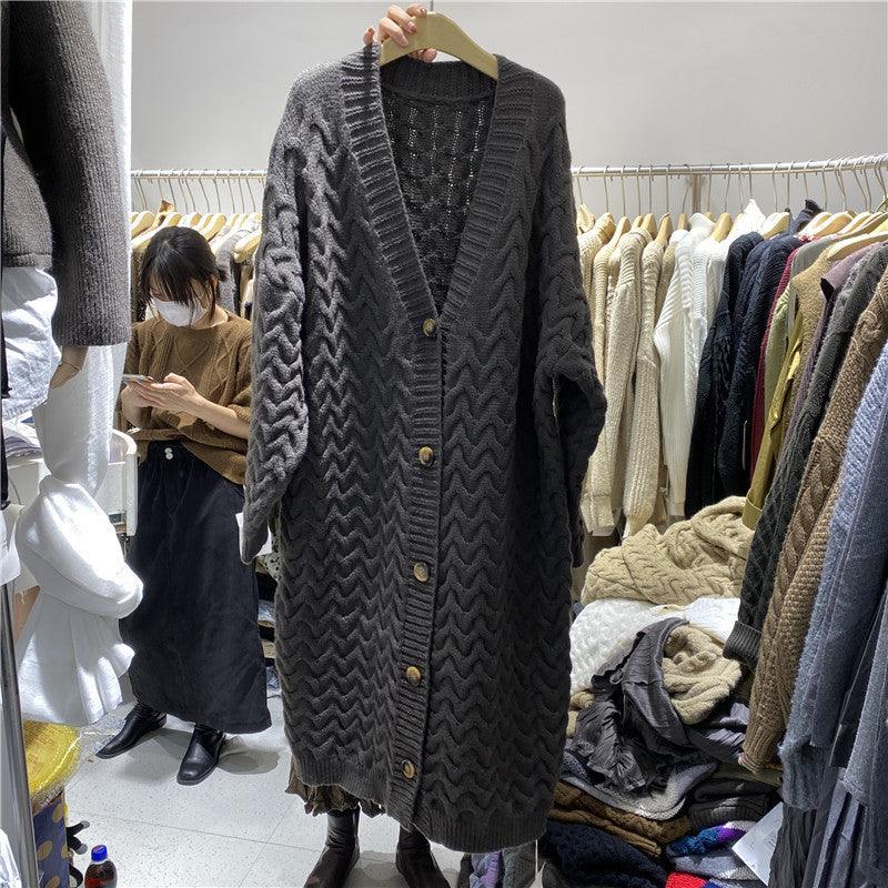 Long thick knitted cardigan in dark grey with cable knit pattern and button-front placket