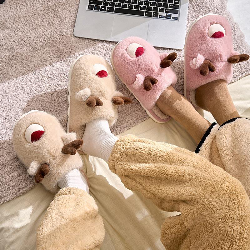 Cartoon plush slippers with elk face and antlers, inner velvet lining in cream and pink.