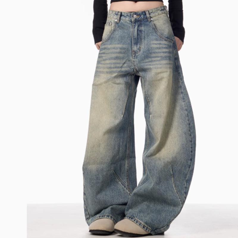 Light blue wide-leg jeans with washed distressed finish and high-rise waist
