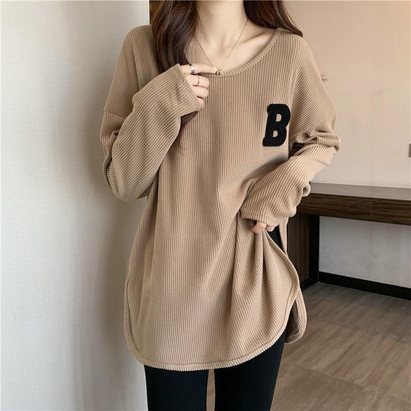 Camel long-sleeve base top with ribbed knit and black “B” patch on chest