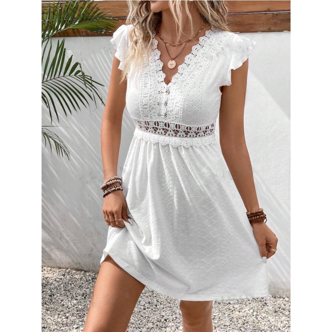 White embroidered lace V-neck mini dress with flutter sleeves and cinched elastic waist