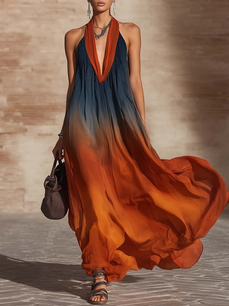 Sleeveless maxi dress with V-neck and orange/dark blue abstract pattern, tiered hem