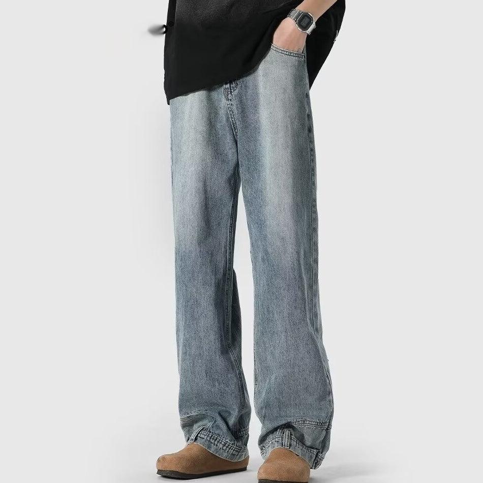 Light blue washed wide-leg jeans with cuffed hem and relaxed fit at the ankles