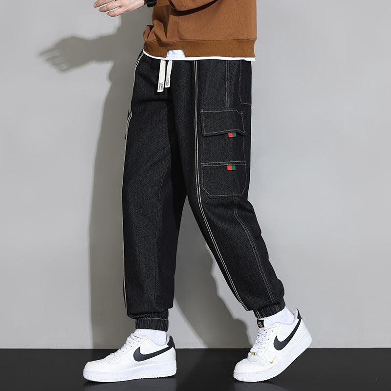 Men's black retro workwear jeans with cargo flap pockets and drawstring cuffs