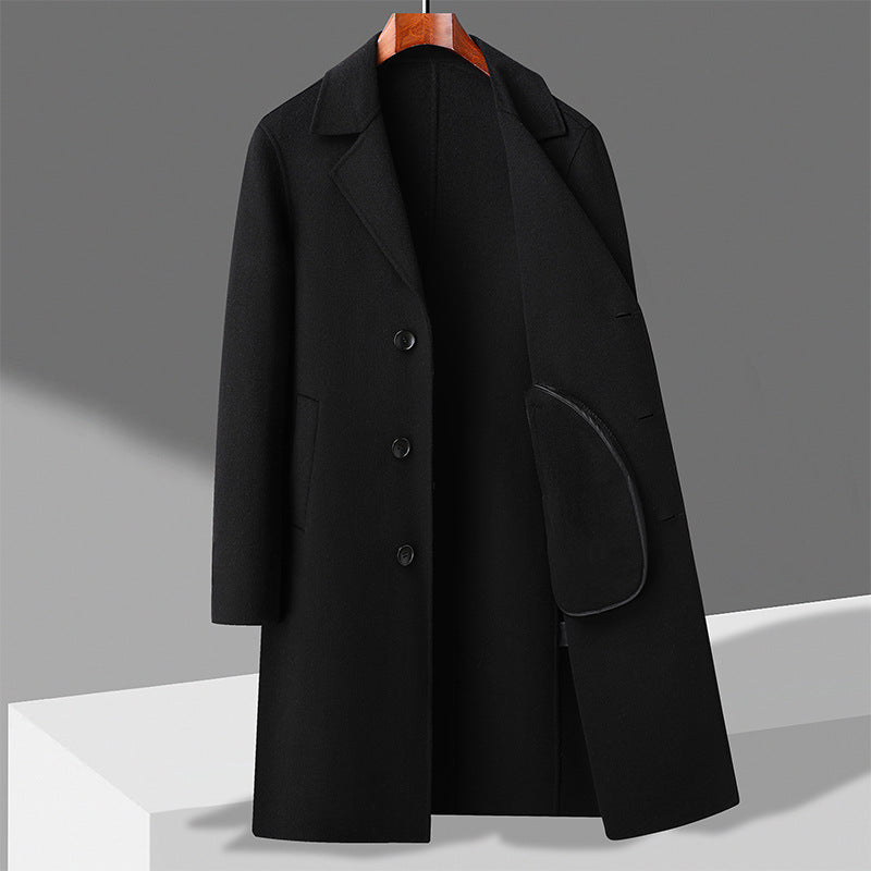 Black long wool coat with notch lapels, button front, and flap side pocket