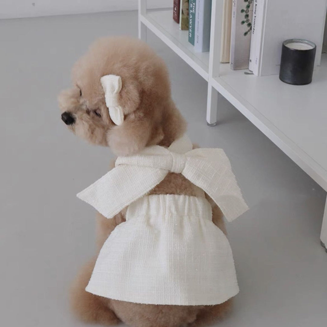 White dog suspender skirt dress with chest bow and gathered waist skirt