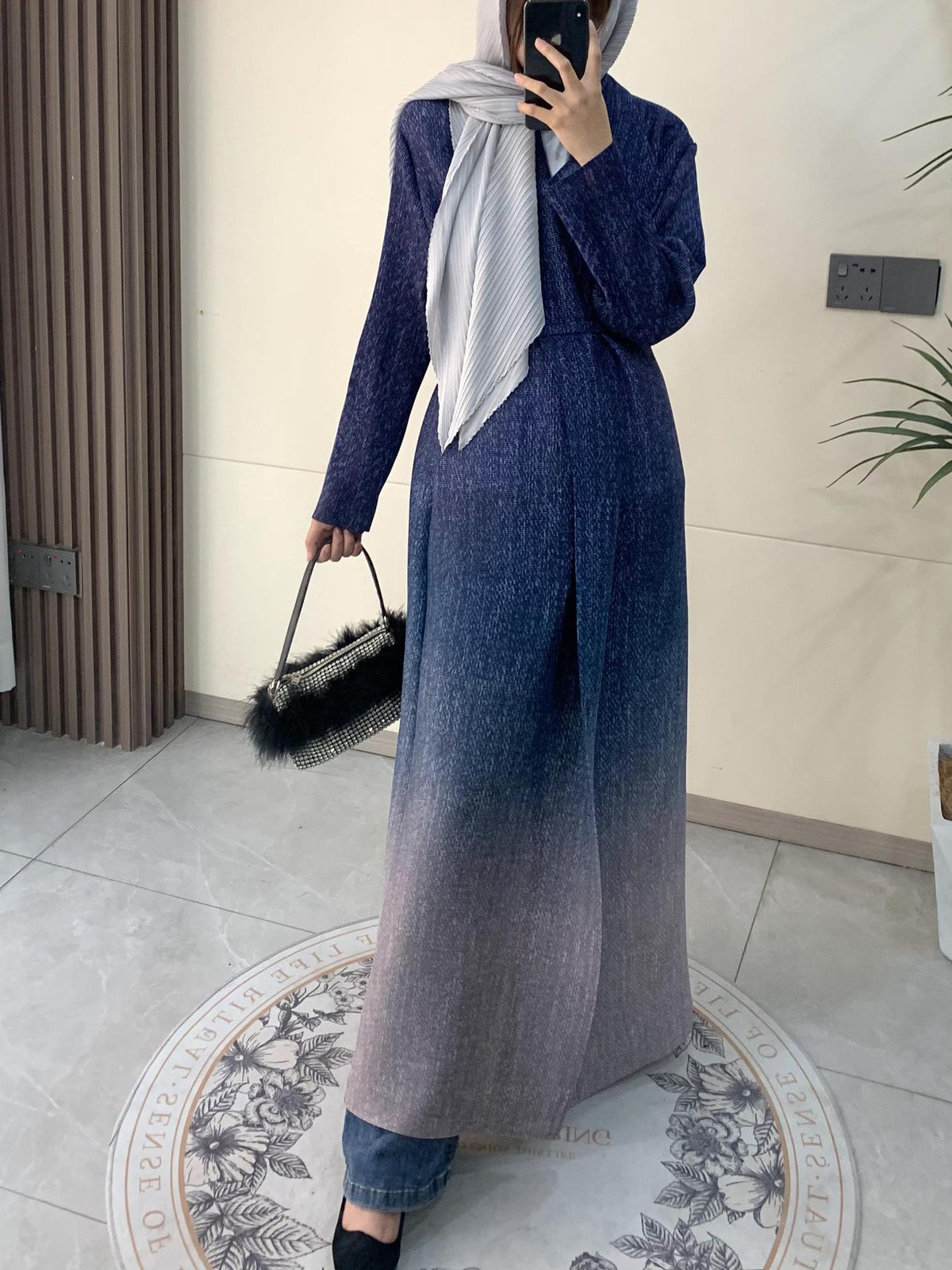 Denim-blue coat cloak with open front, striped headscarf, and side pockets
