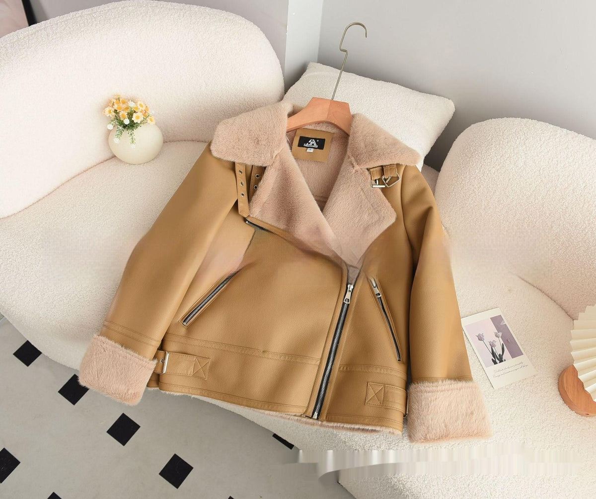 Women’s apricot lamb coat laid flat, shearling collar, zip front, and tan fuzzy cuffs
