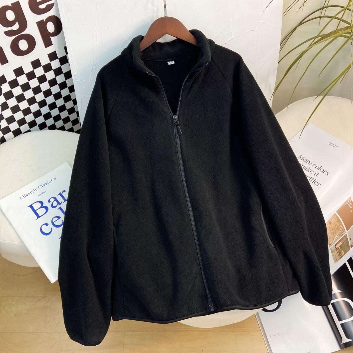 Black polar fleece zip-up coat jacket with stand collar and full front zipper