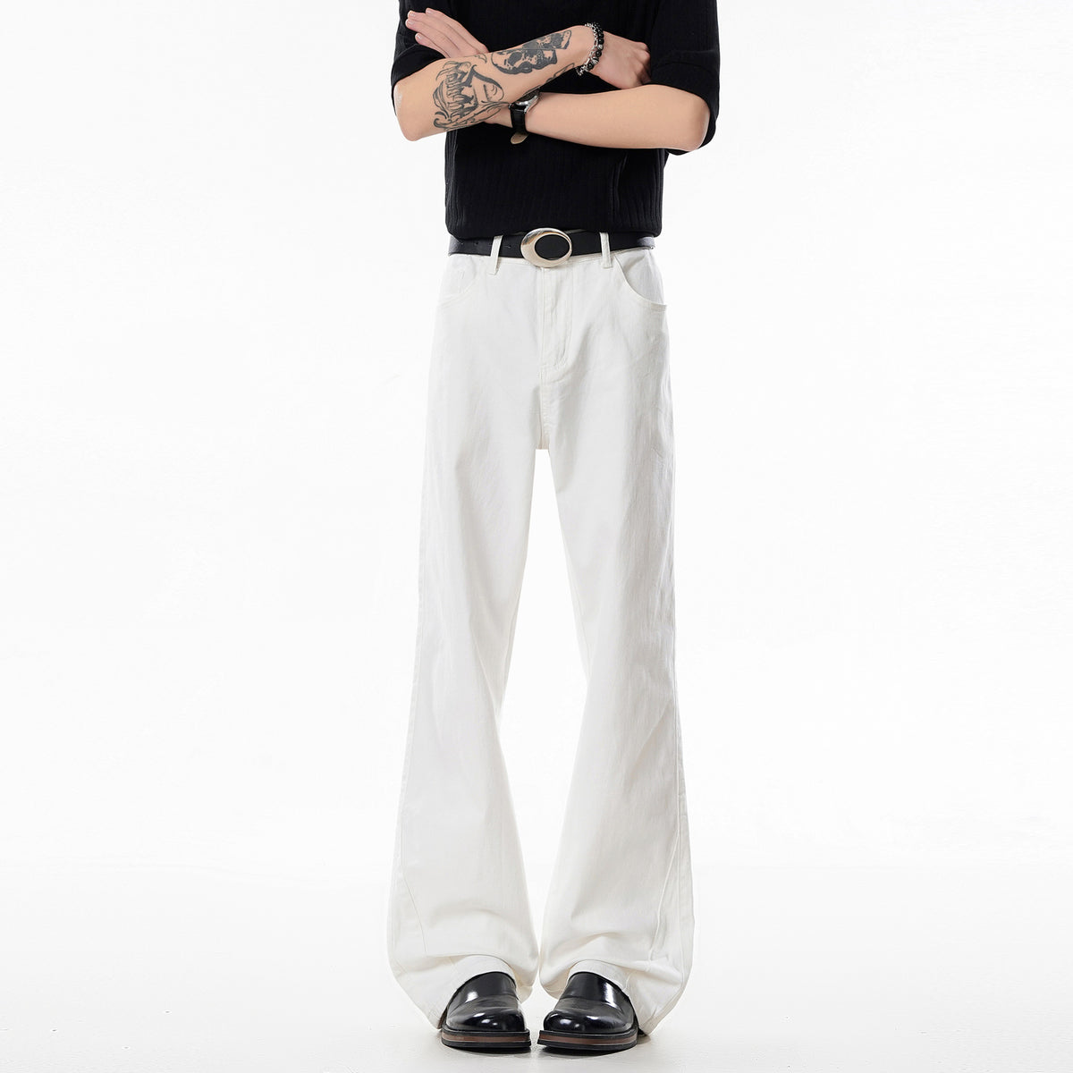White straight-leg jeans with belt loops and front button closure