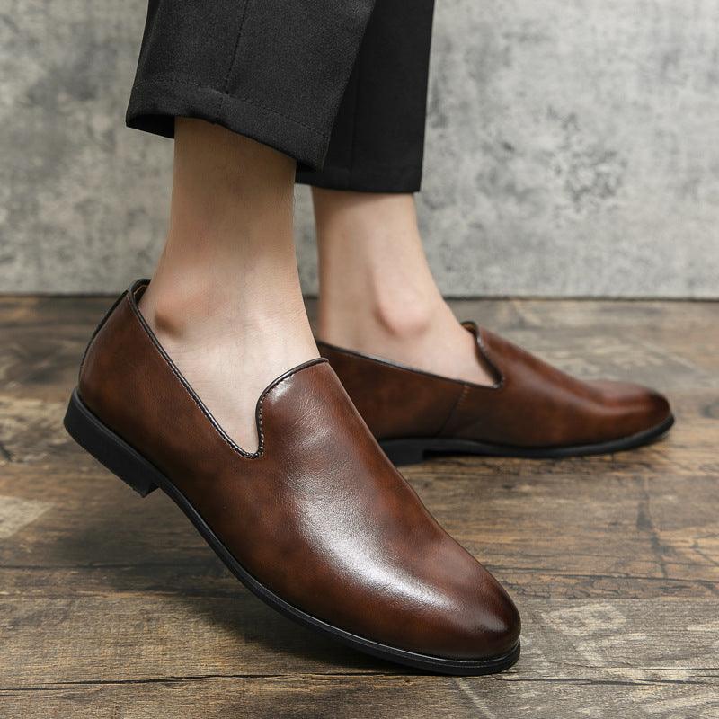 Brown slip-on leather casual shoes with dark sole and stitched V vamp