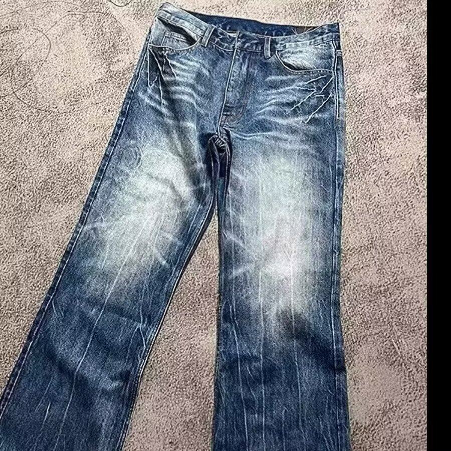 Washed blue loose-fit jeans with straight wide legs, belt loops, and front pockets
