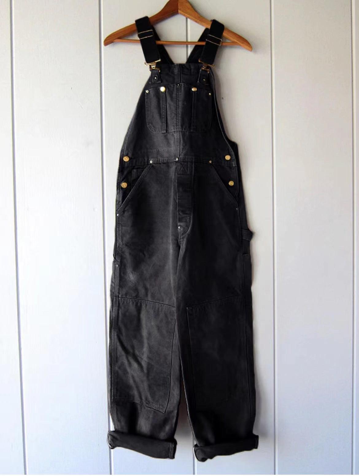 Women’s black high-waist work overalls with front bib, chest pockets, and adjustable shoulder straps