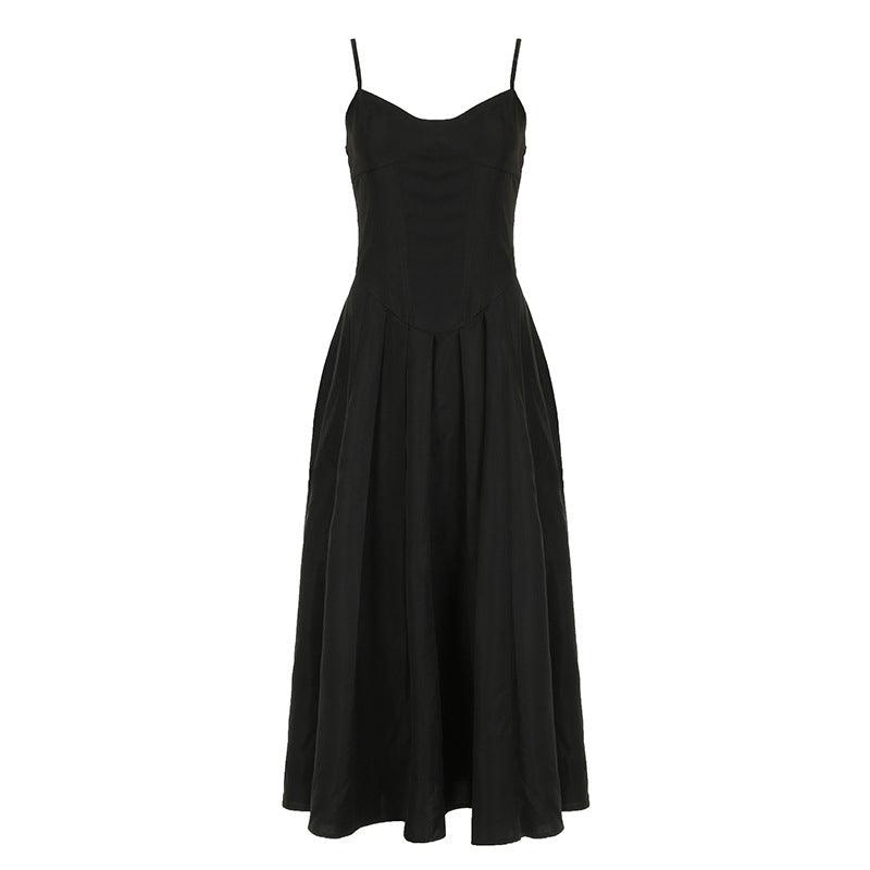 Black V-neck slip dress with spaghetti straps, cinched waist, and flared skirt
