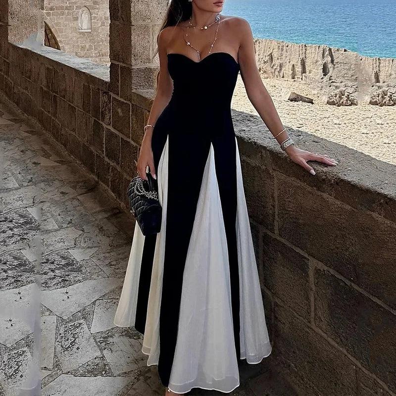 Black strapless tube top maxi dress with white contrast panels and flowing skirt