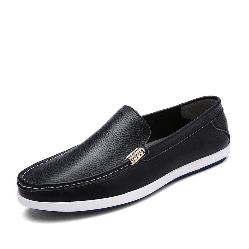 Black leather slip-on casual shoe with gold bit detail and white rubber sole