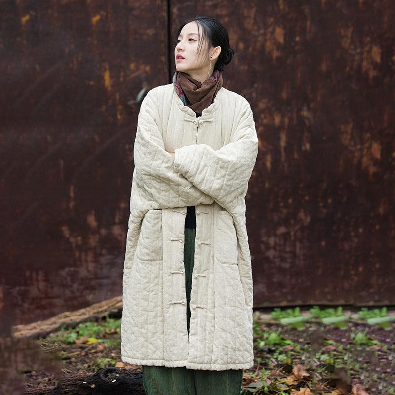Women's quilted hooded robe with button front and patch pockets, yellowish brown.