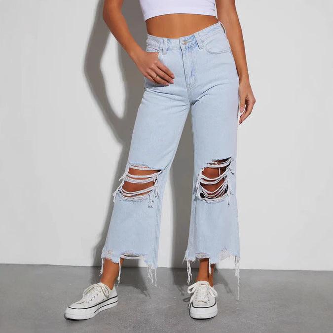 Light blue cropped jeans for women with ripped knees and frayed cuffs