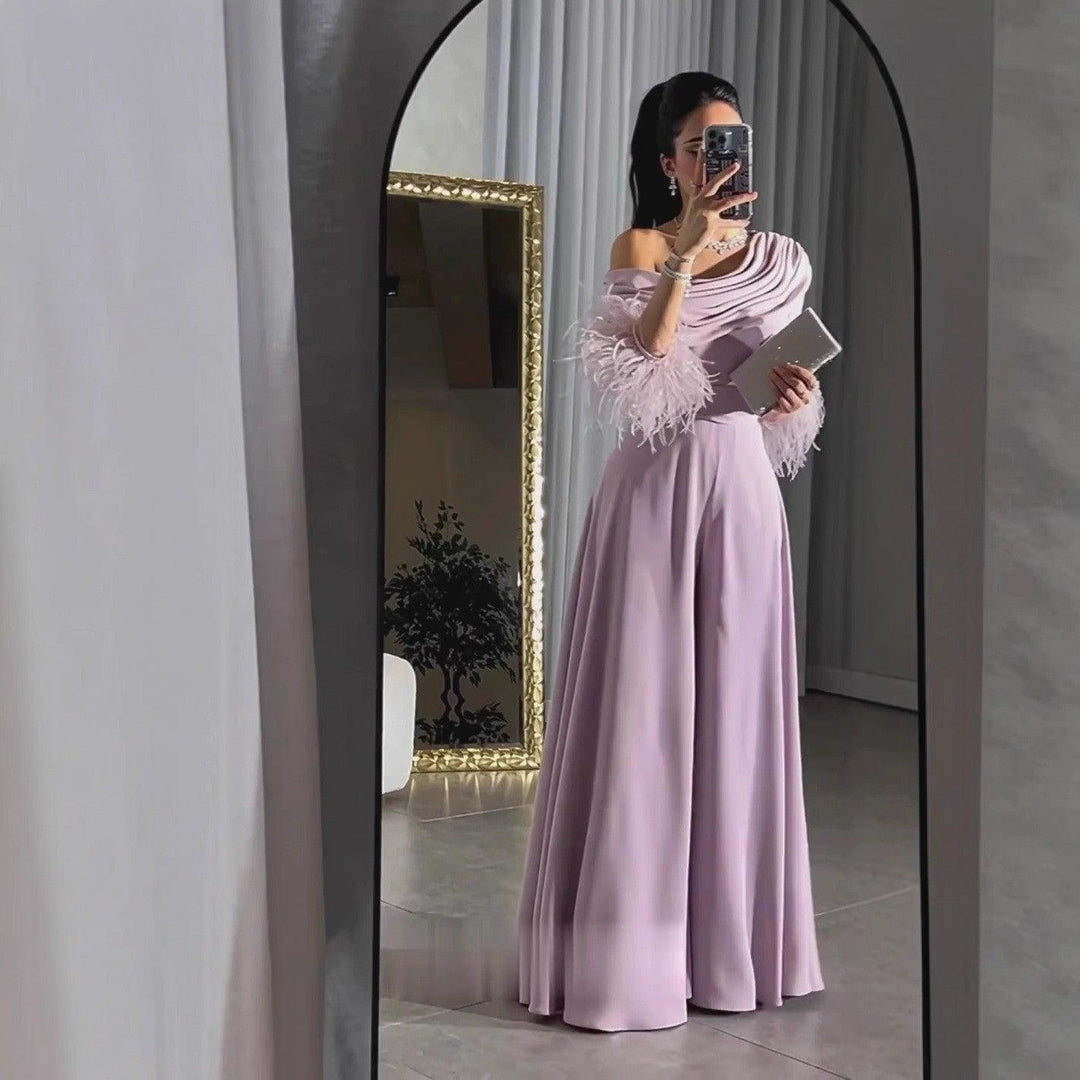 Women's satin jumpsuit with off-shoulder drape and gray feather cuffs, lilac