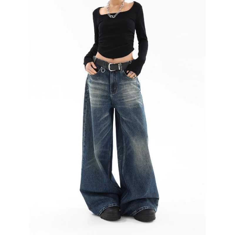 Blue washed straight-leg jeans with button fly and metal zipper, relaxed wide leg