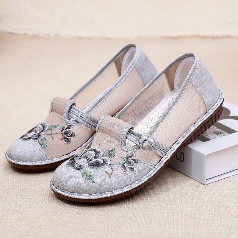 Pair of gray embroidered slip-on shoes with front ribbon bow