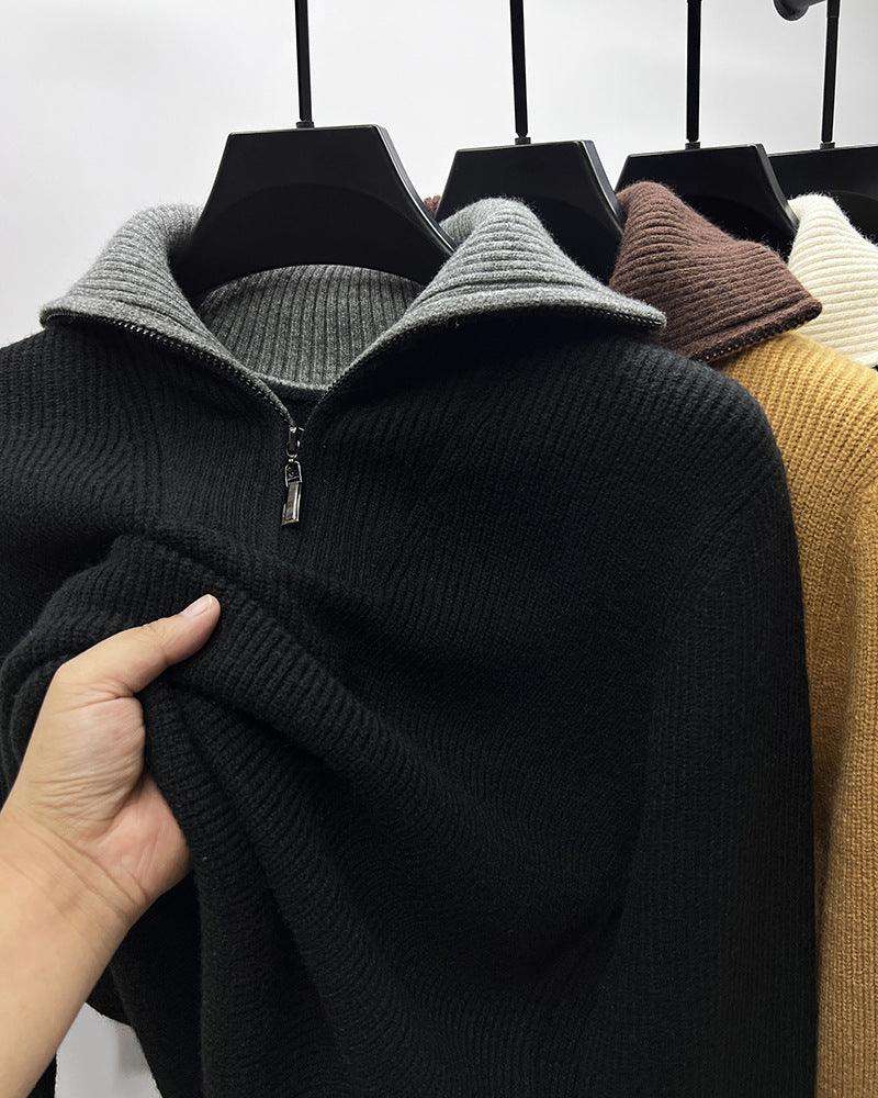 Black ribbed knit sweater with high collar and half-zip, long sleeves