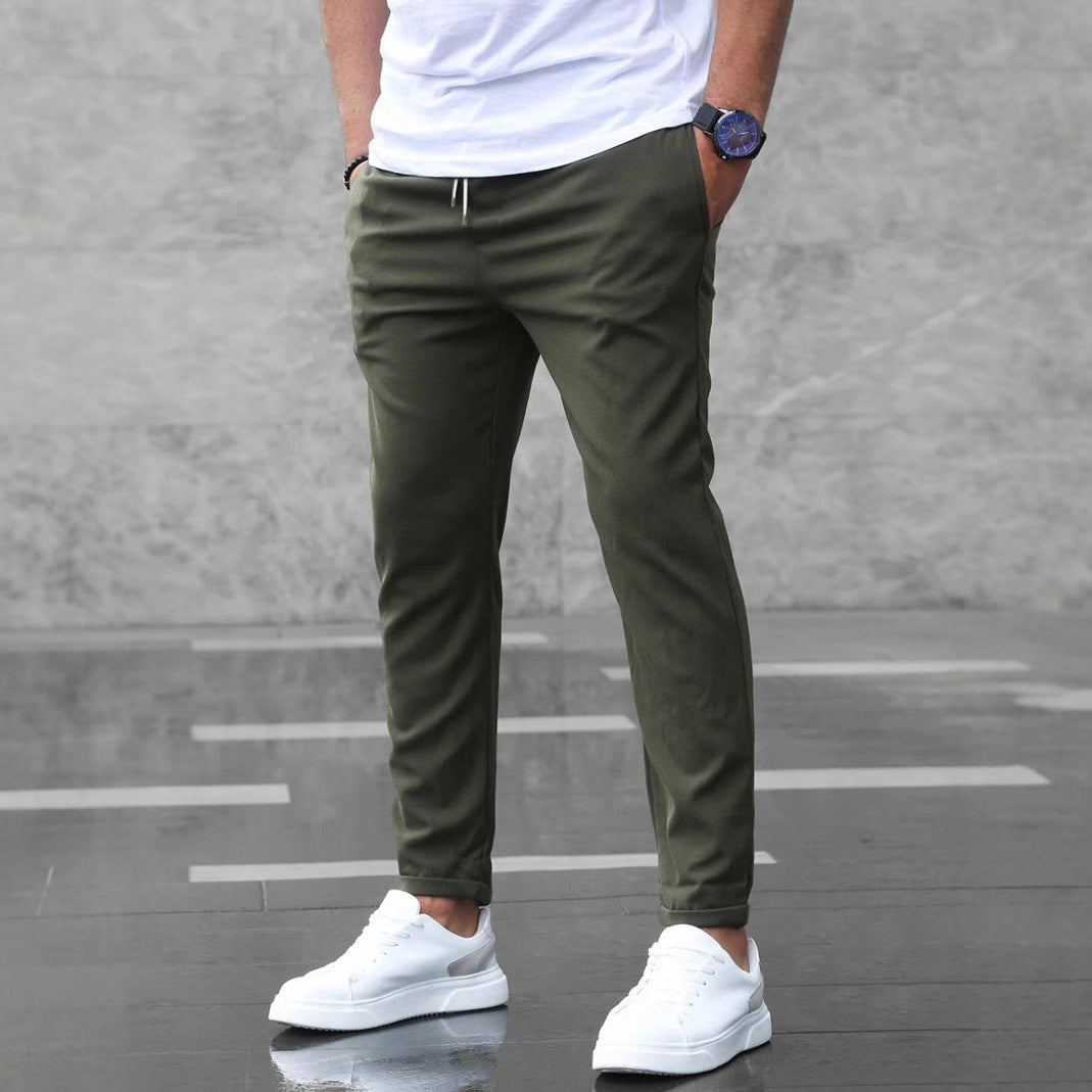 Men's olive cropped pants with drawstring waist and tapered legs