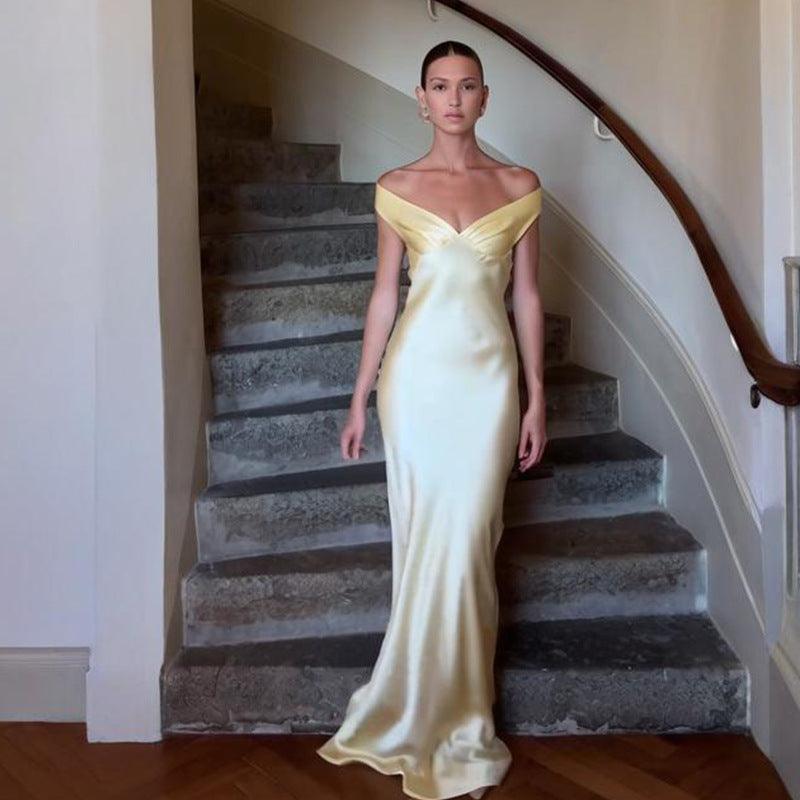 Champagne satin off-shoulder maxi dress with sweetheart bodice and slim long hem