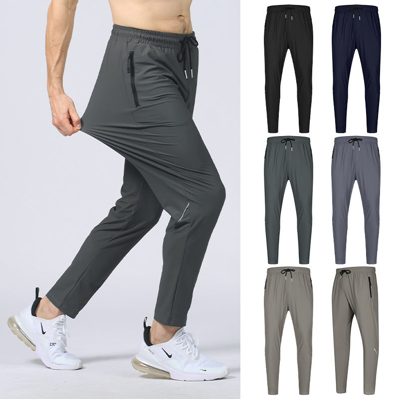 Dark gray exercise workout pants with drawstring elastic waist and zip side pockets