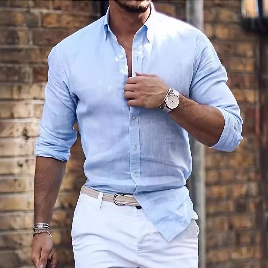 Light blue long-sleeve button-up shirt with pointed collar and front button placket.