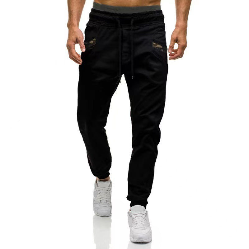 Black cargo pants with drawstring elastic waist and straight legs, ankle cuffs.