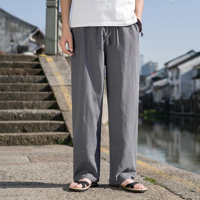 Loose cotton-linen trousers in gray with straight wide legs and drawstring waist