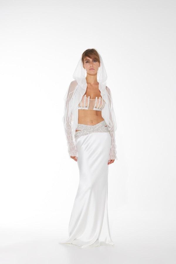 White long evening dress with diamond-embellished bustier, sheer veil, and matching skirt
