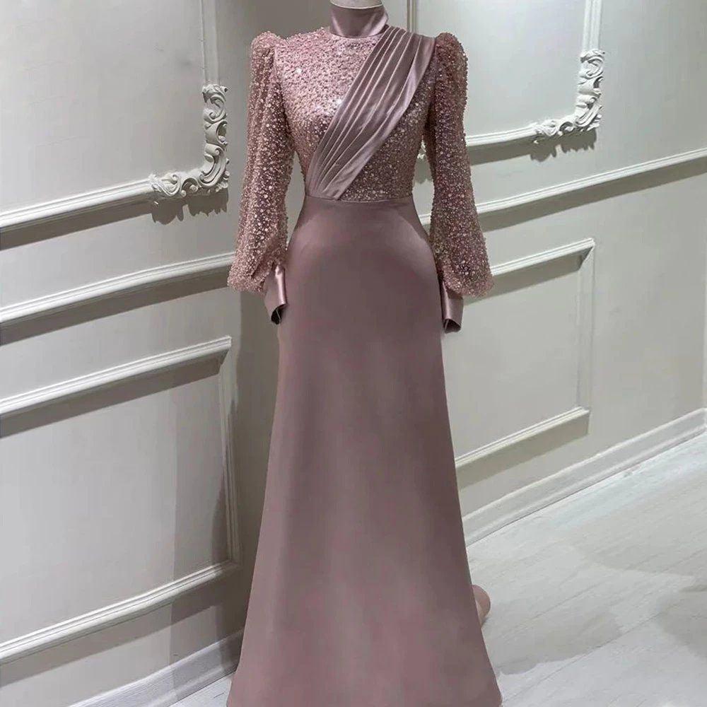 Dusty rose sequin long-sleeve evening dress with diagonal draped neckline and satin skirt