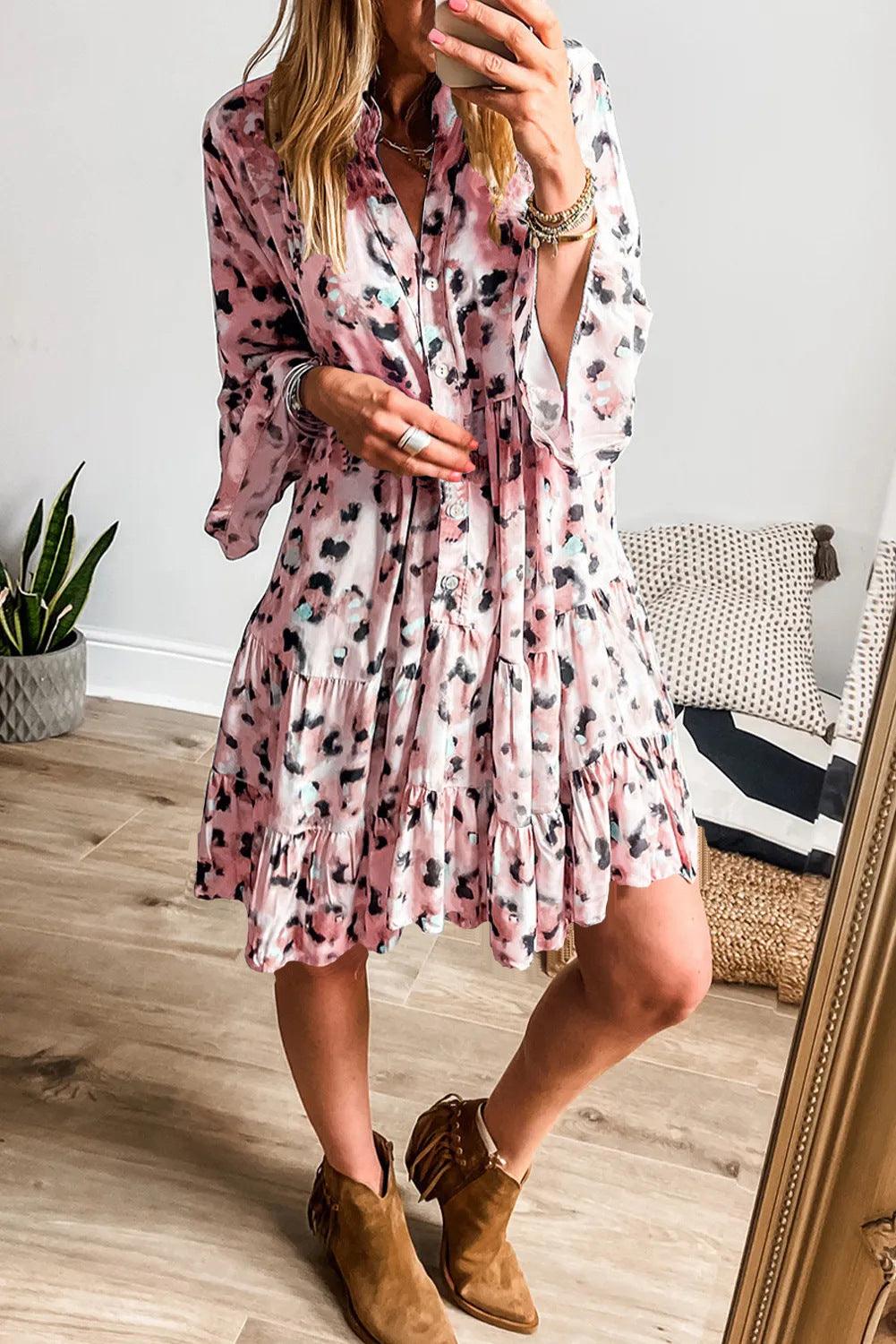 Women's button-front loose dress in dusty rose with black floral spots, tiered skirt