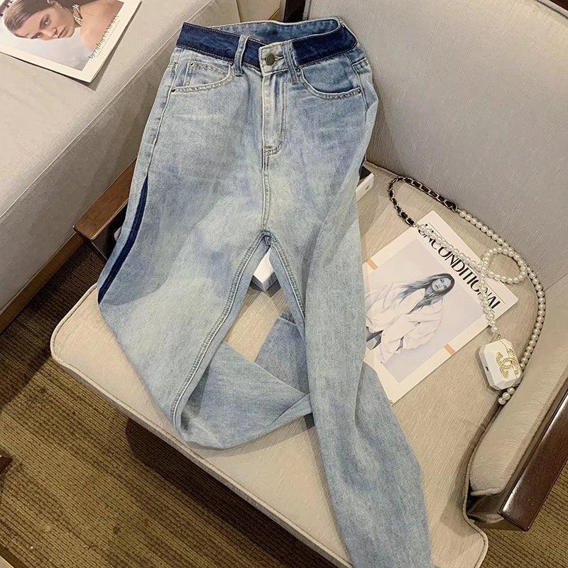Light wash wide-leg jeans with dark side stripes, button fly, high-rise waist