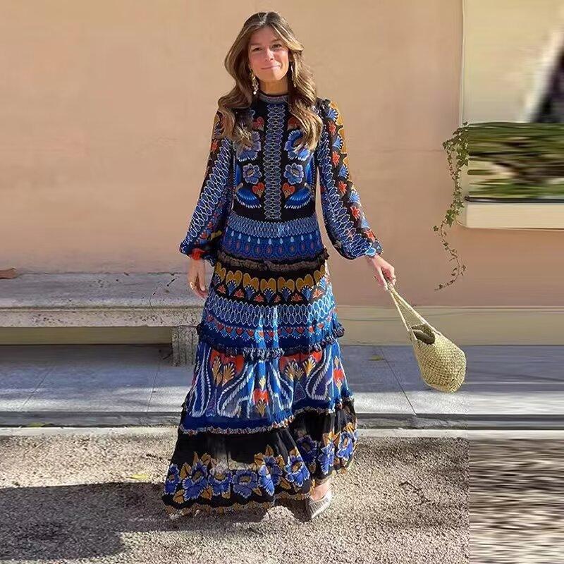 Blue women's tiered midi dress with long sleeves, high neck, multicolor folk print