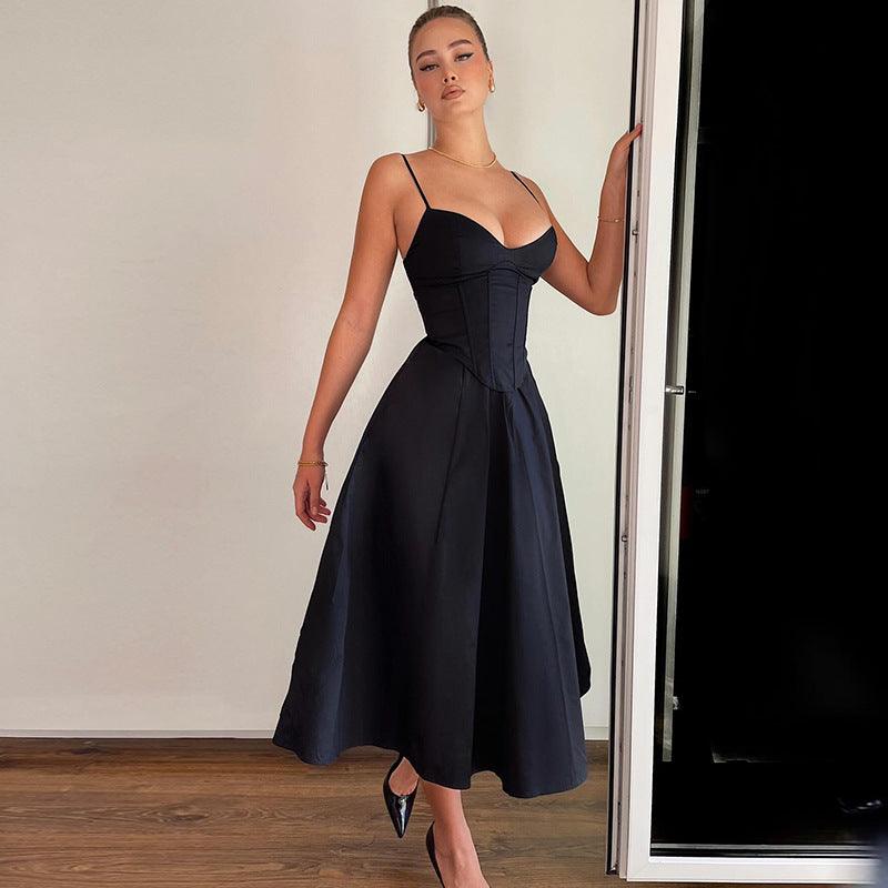 Black V-neck backless slim-waist dress with spaghetti straps and flared midi skirt