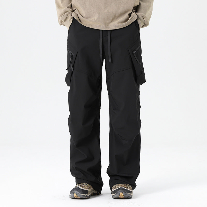 Men's black tactical cargo pants with side flap pockets and drawstring waist