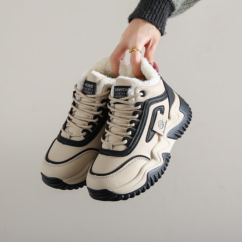 Fleece-lined chunky sneakers, light khaki/cream with black panels and cushioned collar.