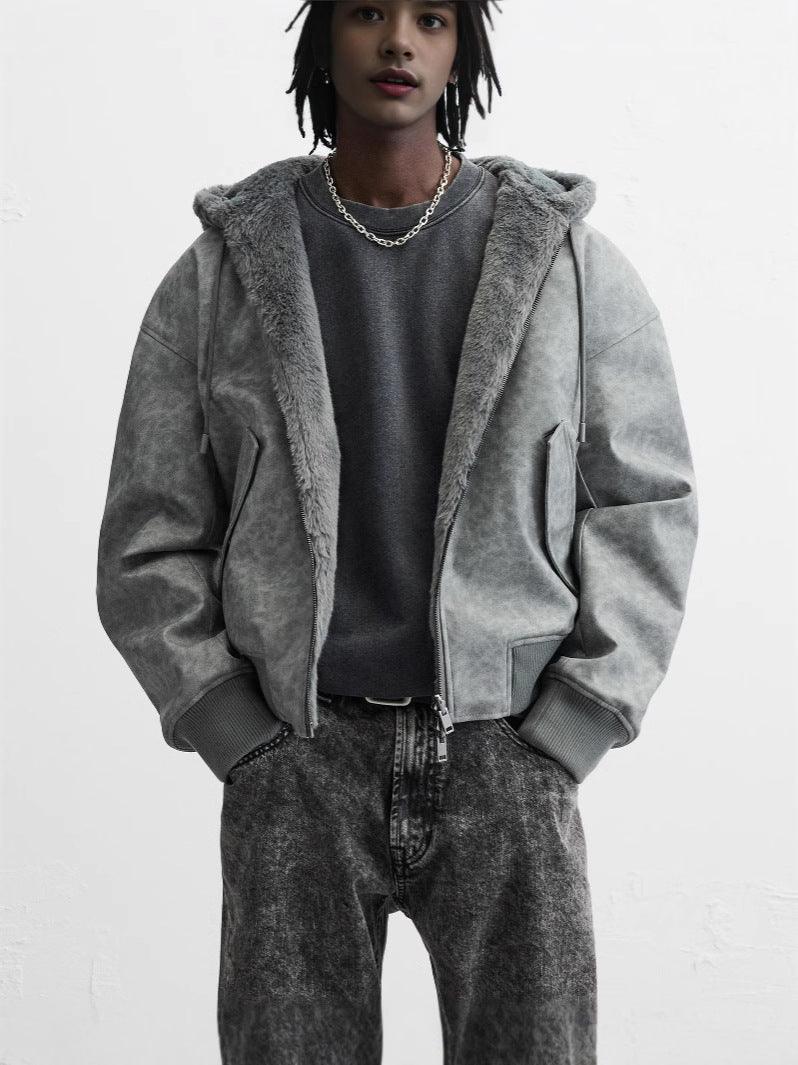Gray hooded bomber jacket on model, zip front with oversized hood and cuffs