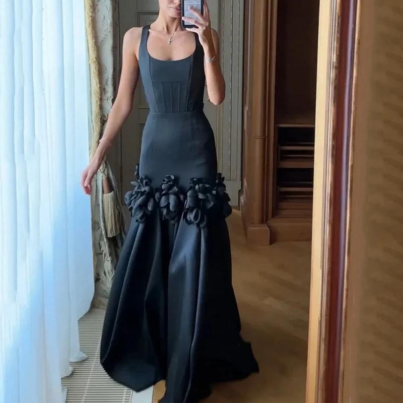 Black halter evening dress with 3D flower appliques at the skirt hem, sleeveless maxi