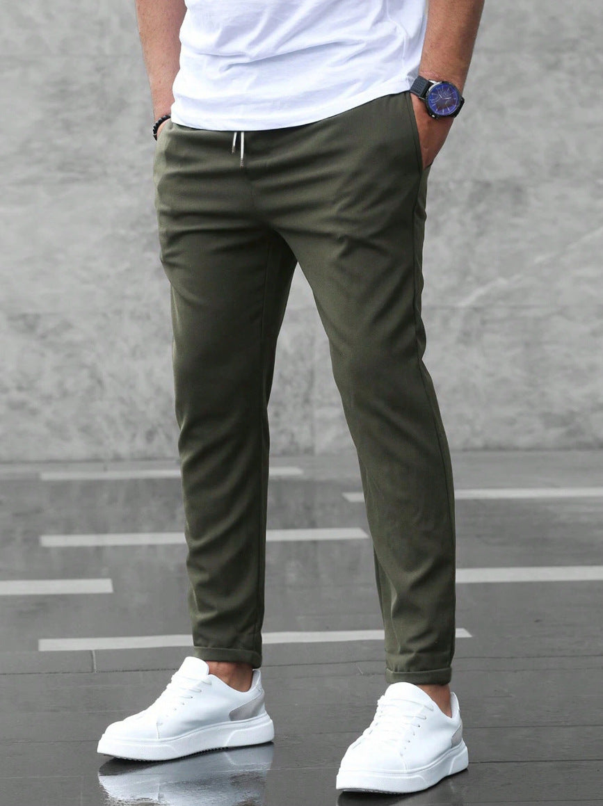 Men's olive cropped pants, front view with drawstring waist