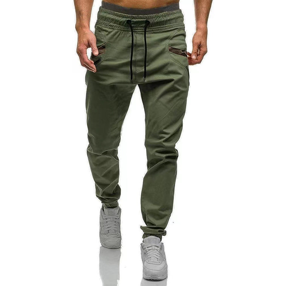 Olive green cargo pants with drawstring elastic waist, straight legs, side cargo pockets.