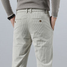 Light gray corduroy casual pants with belt loops and button fly